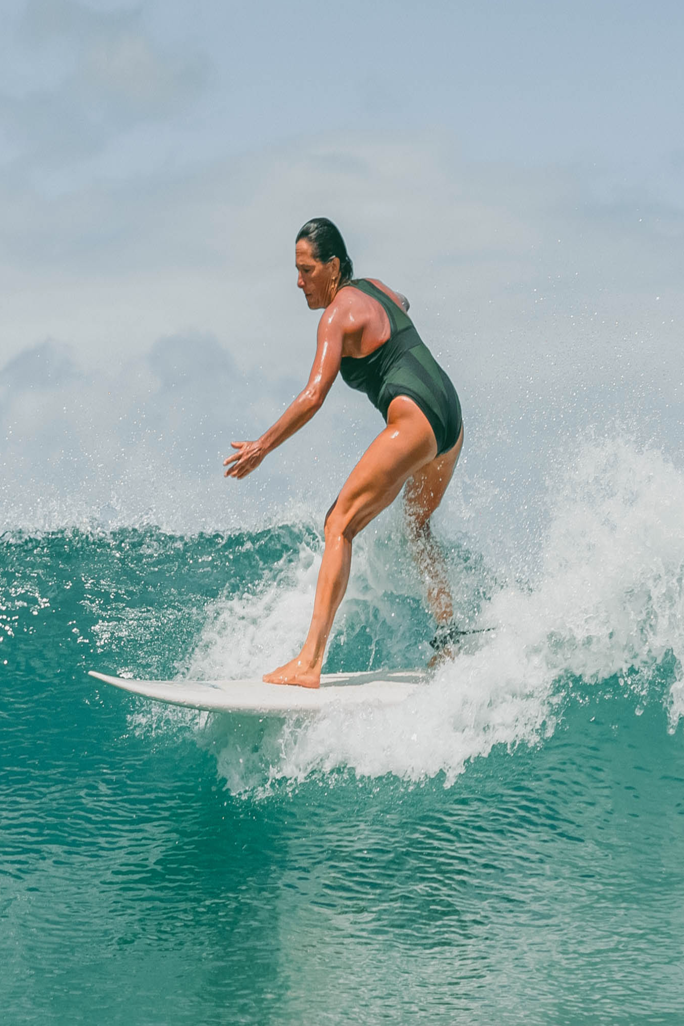 Person surfing on a wave in the ocean